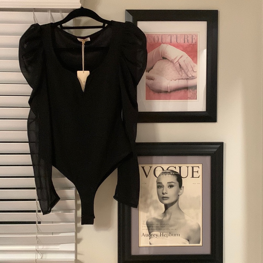 Forever 21 black bodysuit with sheer sleeves. New with tags. Size small.